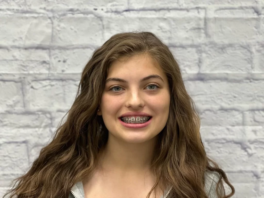 Young girl with braces smiling