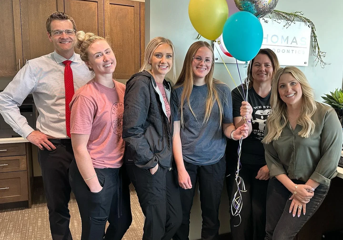Doctor James Thomas and his five employee.